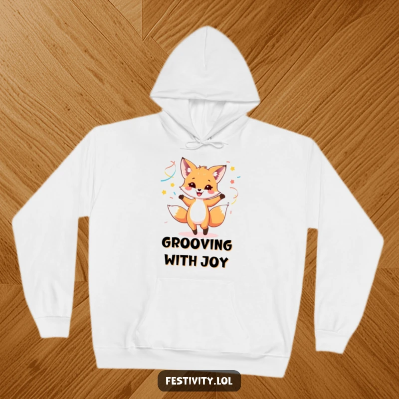 Funny hoodie featuring a happy fox cub dancing with colorful streamers, combining warmth and festive spirit.