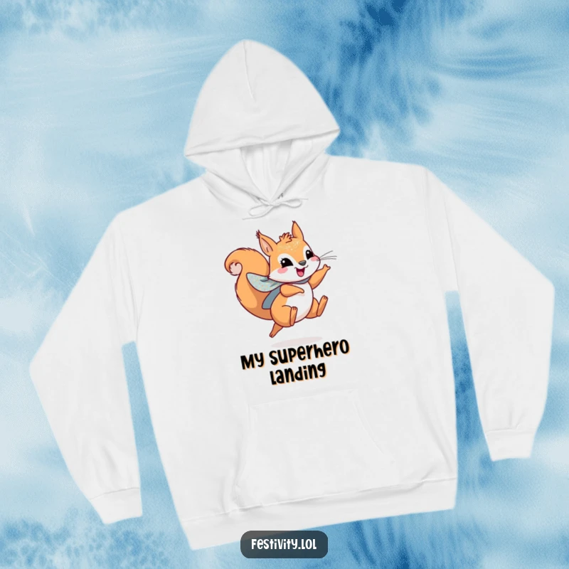 Funny hoodie featuring a playful squirrel wearing a sparkly cape, leaping joyfully for cozy adventures.