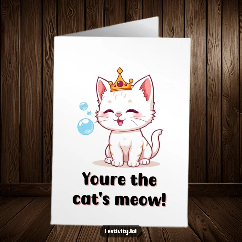 Funny Free Printable Congratulations Card showing a playful kitten adorned with a crown, blowing shimmering bubbles with delight.